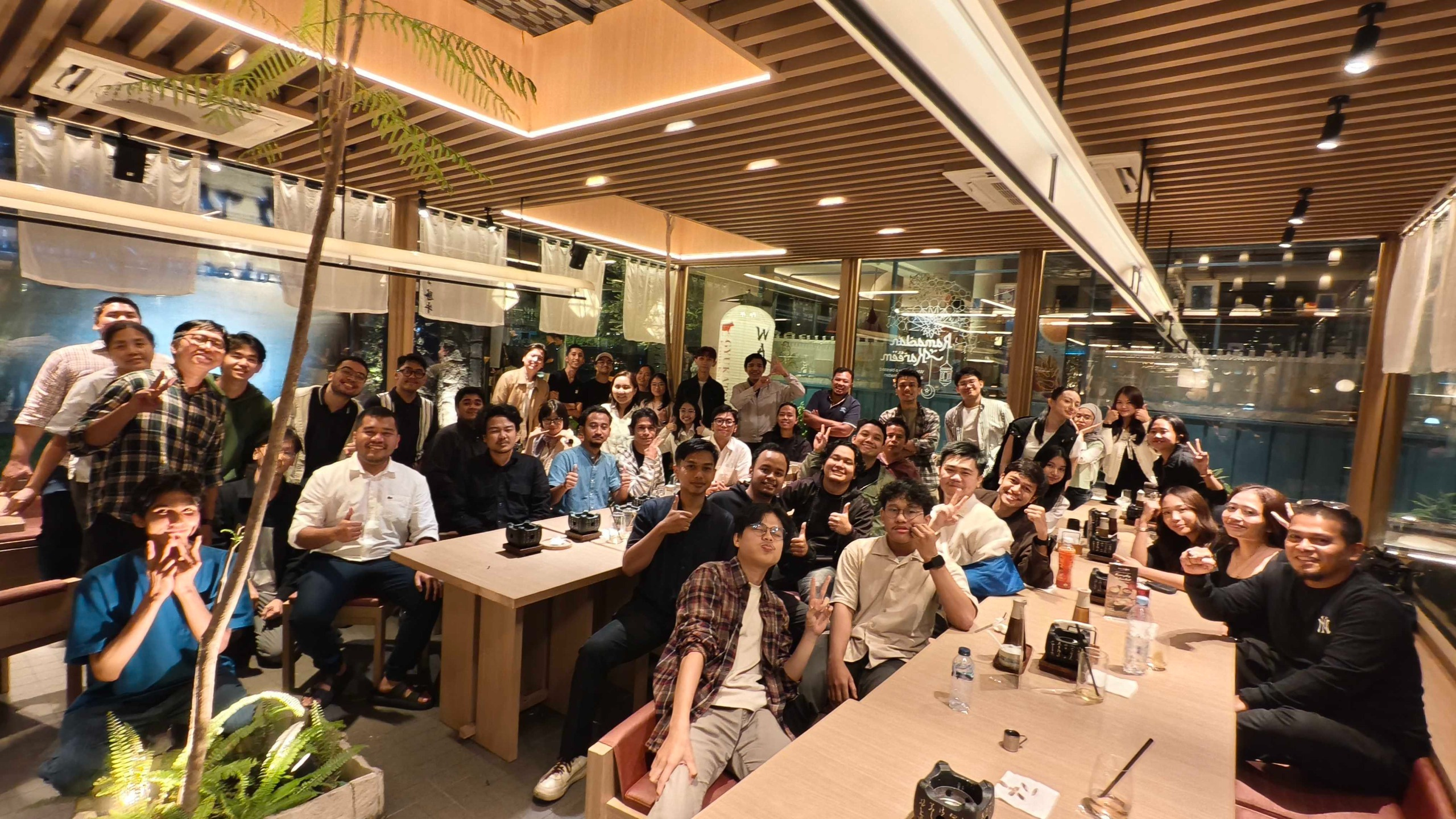 Kevin and the Quantum team gathered together around several tables