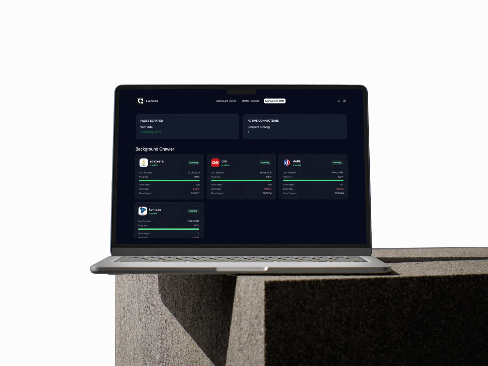Qompass data-management dashboard displayed on a laptop.